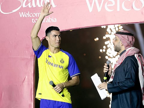 New Al Nassr player Cristiano Ronaldo waves during his presentation