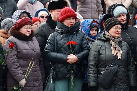Mourners gather to lay flowers in memory of Russian soldiers killed in a Ukrainian strike on Russian-controlled territory, in Samara, on January 3, 2023.