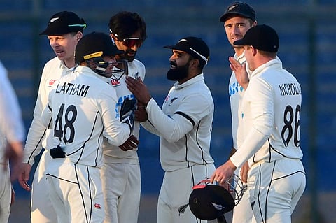 New Zealand's players celebrate after the dismissal of Pakistan's Mir Hamza during the fourth day of the second Test in Karachi on Thursday.