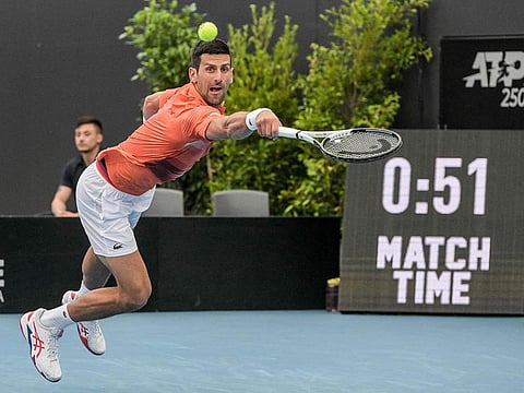Serbia's Novak Djokovic hits a return against France's Quentin Halys during their men's singles match at the Adelaide International tennis tournament in Adelaide on January 5, 2023.  