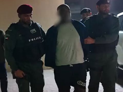 Notorious human smuggler Kidane Zekarias Habtemariam, being taken away by Interpol team after arrest in the UAE-led operation in Sudan. 