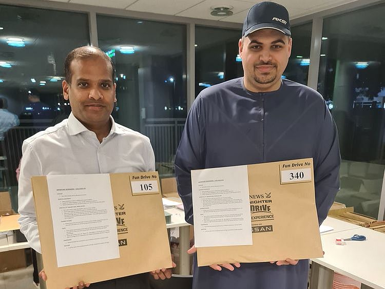 fun drive - registered participants with their info packs in dubai-1673281446483