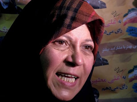  Faezeh Rafsanjani, daughter of former Iranian president Akbar Hashemi Rafsanjani, speaks to a journalist as she attends a reformist campaign for upcoming parliamentary election, in Tehran February 18, 2016.