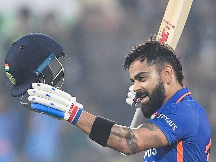 India's Virat Kohli celebrates after scoring a century