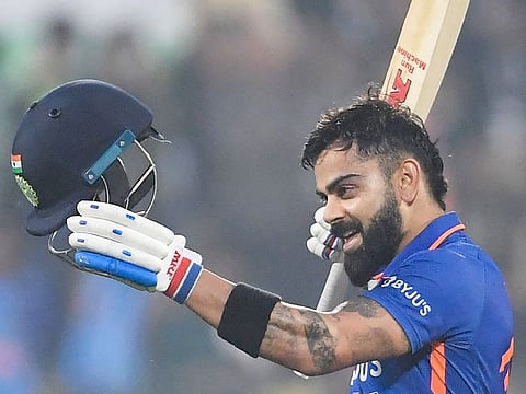 India's Virat Kohli celebrates after scoring a century during the first ODI against Sri Lanka at the Assam Cricket Association Stadium in Guwahati on January 10, 2023. 