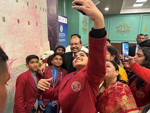 Indian expat student delegates from the UAE take photos with MA Yusuff Ali during the 17th Pravasi Bharatiya Divas at Indore in Indian state Madhya Pradesh on Monday, January 9, 2023.
