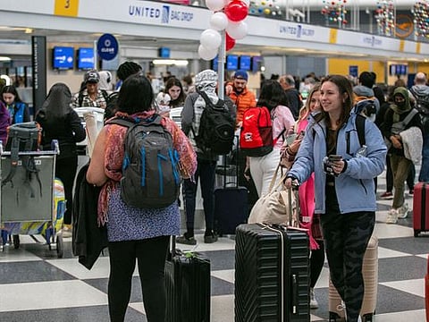Passengers wait for the resumption of flights at O'Hare International Airport.