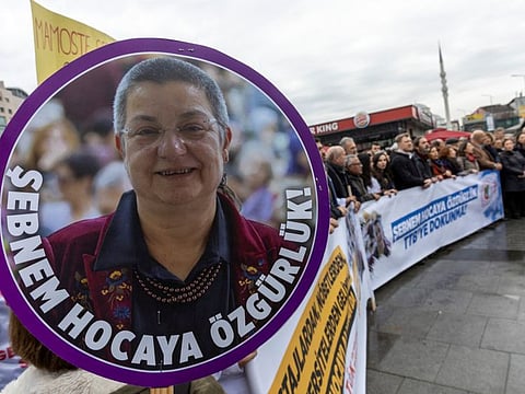 Supporters of the Turkish Medical Association (TTB) head Sebnem Korur Fincanci, who is accused of "spreading terrorist group propaganda" and insulting Turkish institutions for her comments on the alleged use of chemical weapons by the Turkish armed forces, demonstrate in front of the Justice Palace, the Caglayan Courthouse, in Istanbul January 11, 2023.  