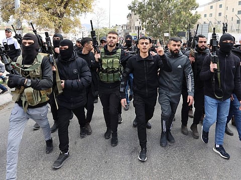 Palestinian gunmen attend the funeral of Ahmed Adu Junaid, who was killed the previous day during clashes with Israeli forces in the Balata refugee camp in Nablus, on January 12, 2023.