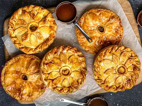 Hearty steak pie with mashed potatoes and red onion jam