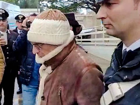 File photo: Top Mafia boss Matteo Messina Denaro, centre, leaves an Italian Carabinieri barrack soon after his arrest.