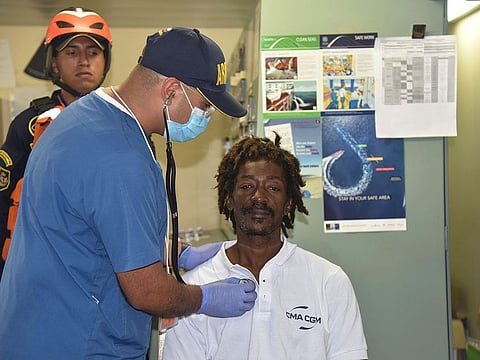 Castaway Elvis Francois is attended by Colombian Navy members after he was rescued near the department of La Guajira.