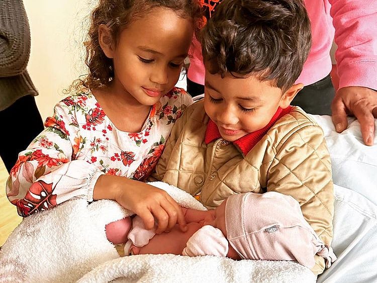 Chrissy Teigen and their kids 