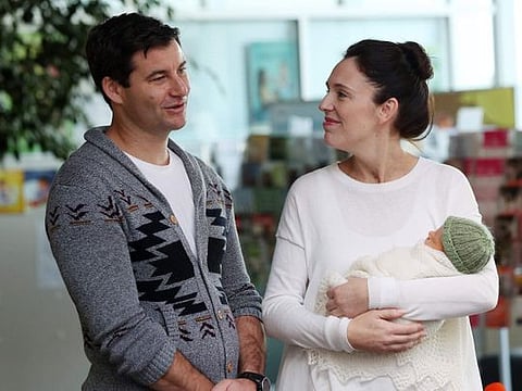 New Zealand Prime Minister Jacinda Ardern and partner Clarke Gayford pose with their baby daugther Neve Te Aroha Ardern Gayford outside the hospital in Auckland on June 24, 2018. Ardern, who she will resign next month, showed what it took to be a leader and a parent, and how eventually it took so much that she could not in good conscience continue doing it, not in the way she would have liked. 