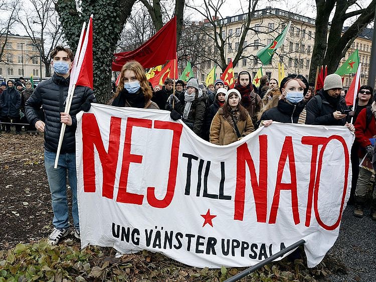 People take part in a demonstration against Turkish President Recep Tayyip Erdogan arranged by The Kurdish Democratic Society Centre in Sweden, in Stockholm, on January 21. 2023. 