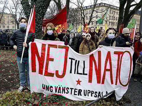 People take part in a demonstration against Turkish President Recep Tayyip Erdogan arranged by The Kurdish Democratic Society Centre in Sweden, in Stockholm, on January 21. 2023. 