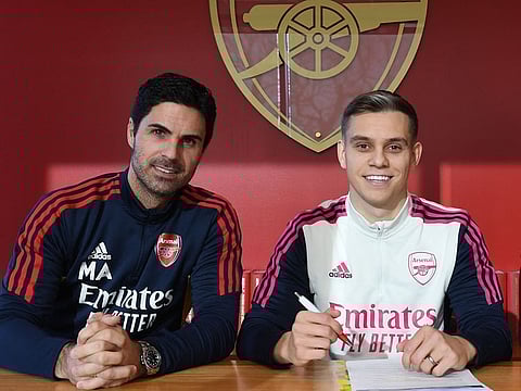 Arsenal coach Mikel Arteta (left) with new signing Leandro Trossard.