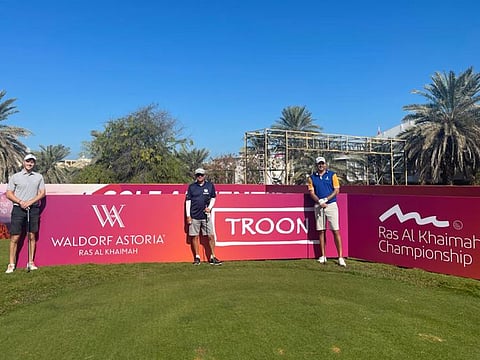 Simon Dunn (right), leader after round two at Al Hamra Golf Club with his playing partners.