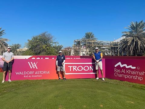 Simon Dunn (right), leader after round two at Al Hamra Golf Club with his playing partners.