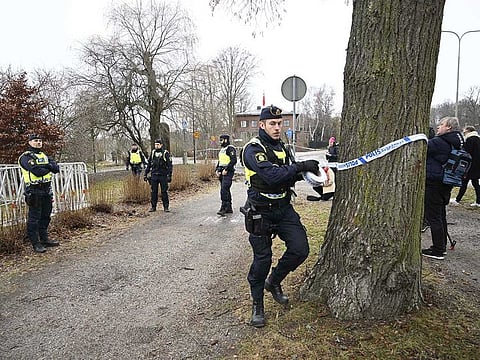 Police cordon off the area outside the Turkish embassy in Stockholm, Sweden, Saturday Jan. 21, 2023.