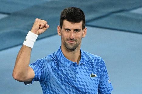Serbia's Novak Djokovic celebrates after victory against Australia's Alex De Minaur during their men's singles match on day eight of the Australian Open tennis tournament in Melbourne.