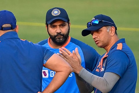 India's coach Rahul Dravid (right) and captain Rohit Sharma (centre) attend a practice session at the Holkar Cricket Stadium in Indore on the eve of their third and final one-day international (ODI) match against New Zealand.