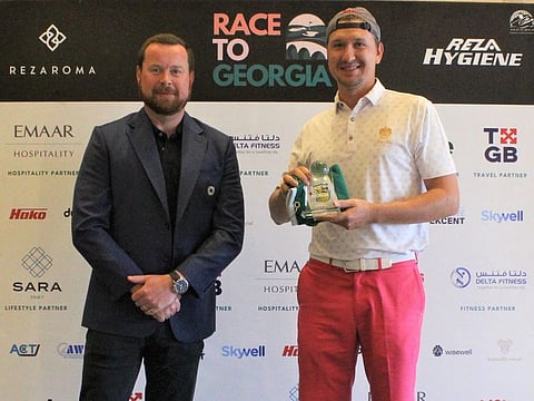 Winner of the Race to Georgia Jumeirah Golf Estates Qualifying Round Boris Krasnenkov (right) with JGE Men's Captain Jonathan Hall