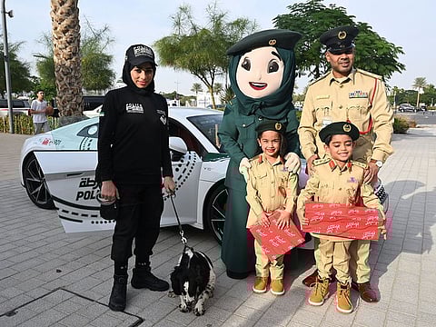 Aosha and Hamad Ahmad Al Mulla with Dubai Police officials.