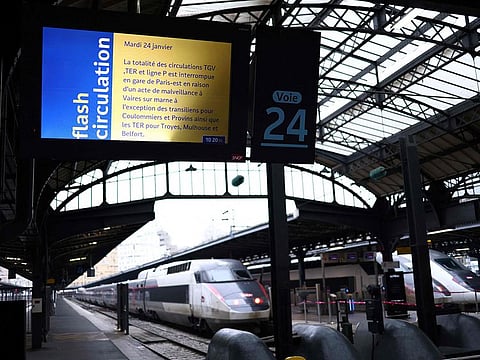 A photo shows a screen displaying a traffic alert message at a platform entrance during a total traffic shutdown at the Gare de l'Est train station in Paris.