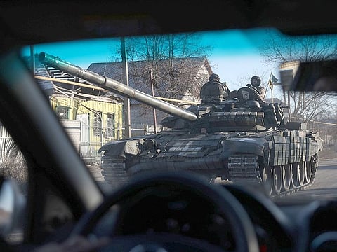 Ukrainian servicemen ride a T-80 tank not far from Lyman, Donetsk region on January 24, 2023.  