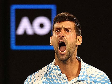 Serbia’s Novak Djokovic reacts during his quarter final match against Russia’s Andrey Rublev.