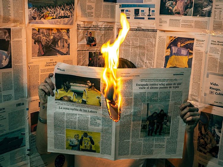 Newspaper on fire