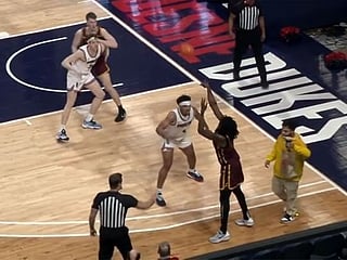 Watch: Apparent food delivery interrupts college basketball game 
