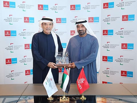 Sheikh Ahmed bin Saeed Al Maktoum, Chairman and Chief Executive of Emirates Airline and Group and Zaki Anwar Nusseibeh, Cultural Advisor to the President of the UAE, Chancellor of the United Arab Emirates University, and Member of the Board of Trustees at AGD exchange gifts