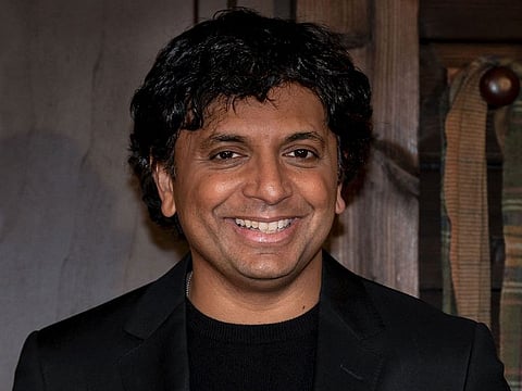US filmmaker M. Night Shyamalan poses during a photocall for his movie "Knock At The Cabin" in Paris.