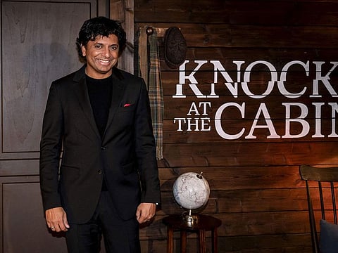 US filmmaker M. Night Shyamalan poses during a photocall for his movie "Knock At The Cabin" in Paris.