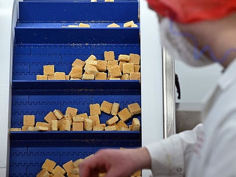 Employees work at Pecan Deluxe Candy's manufacturing site in Sherburn-in-Elmet, northern England.