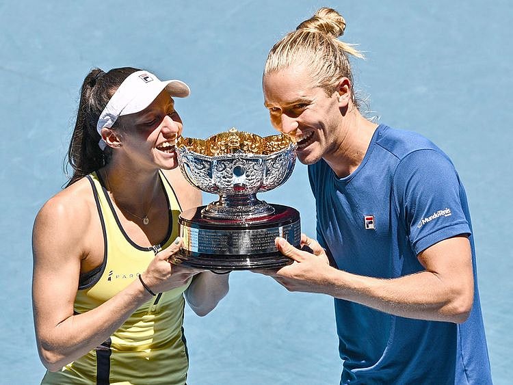 Brazil's Luisa Stefani (L) and Rafael Matos pose with the trophy