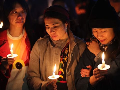 A makeshift memorial for victims of a mass shooting in front of the Star Ballroom Dance Studio in Monterey Park, California, on January 26, 2023. In the back-to-back mass shootings in northern and southern California in a week, 18 people were killed. A research found that many US gun owners take little or no precautions to prevent children from having access to a gun.  