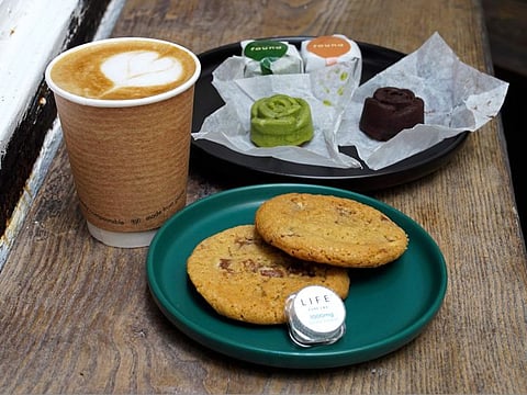Coffee, biscuits, green tea and chocolate mooncake that contain cannabidiol, or CBD, a substance from the cannabis plant, are displayed at the Found Cafe in Hong Kong on September 13, 2020. 
