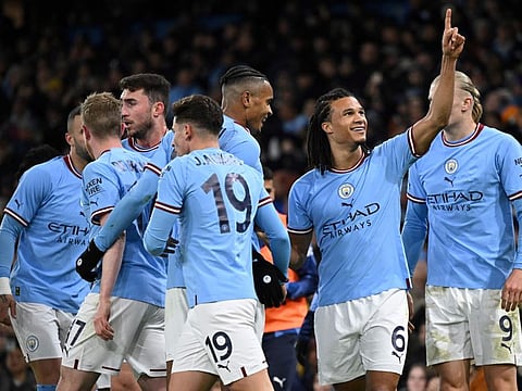 Manchester City's defender Nathan Ake (second right) celebrates with teammates after scoring during the English FA Cup fourth round match against Arsenal at the Etihad Stadium in Manchester, northwest England.