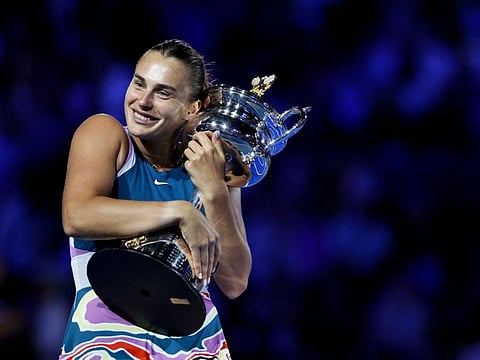 Belarus' Aryna Sabalenka poses with the trophy after winning against Kazakhstan's Elena Rybakina during the women's singles final on day thirteen of the Australian Open tennis tournament in Melbourne.