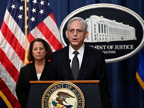 US Attorney General Merrick Garland, with Deputy Attorney General Lisa Monaco, speaks during a press conference at the Justice Department in Washington, DC, on January 27, 2023.  
