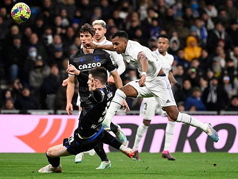 Real Madrid's forward Rodrygo (right) vies with Real Sociedad's midfielder Igor Zubeldia during the Spanish league football match at the Santiago Bernabeu stadium in Madrid.