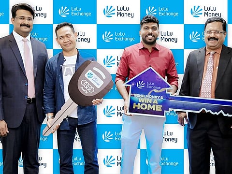 LuLu Exchange Send Money & Win a Home promotion's grand prize winner, Brijal John Pallathusseriyil, and Audi A3 car winner, Bagus Made Sutama with AVP, Thampi Sudarsanan and GM, Shaiju Mohandas, at the grand prize distribution ceremony conducted in Dubai