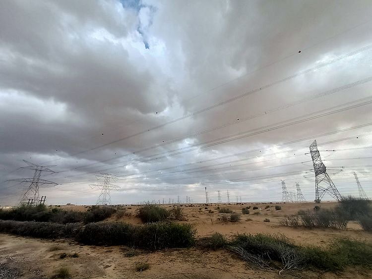 Rain clouds, rain, clouds, rain clouds hover above Emirates road