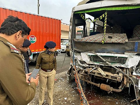  Deputy Commissioner of Police (Central District) Shweta Chauhan inspects the damaged bus after it got collided with two other vehicles, at Salimgarh flyover, in New Delhi, on Monday. 