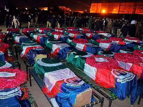 Security officials gather for funeral prayers of police officers who were killed in the suicide bombing.