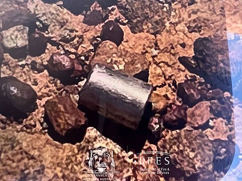 A radioactive capsule, which had fallen off a truck, after it was found along a desert highway south of Newman, Western Australia.