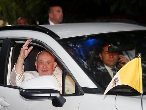 Pope Francis gestures, while on his way to the nunciature, after leaving the national Palace in Kinshasa, Democratic Republic of Congo .